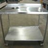 Photo of MOBILE STAINLESS STEEL PREP BENCH WITH SCRAPS HOLE